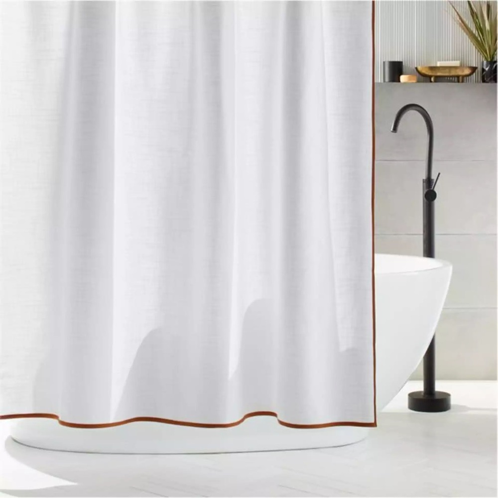 Slightly used CB2 shower curtain with supporting shower rings.